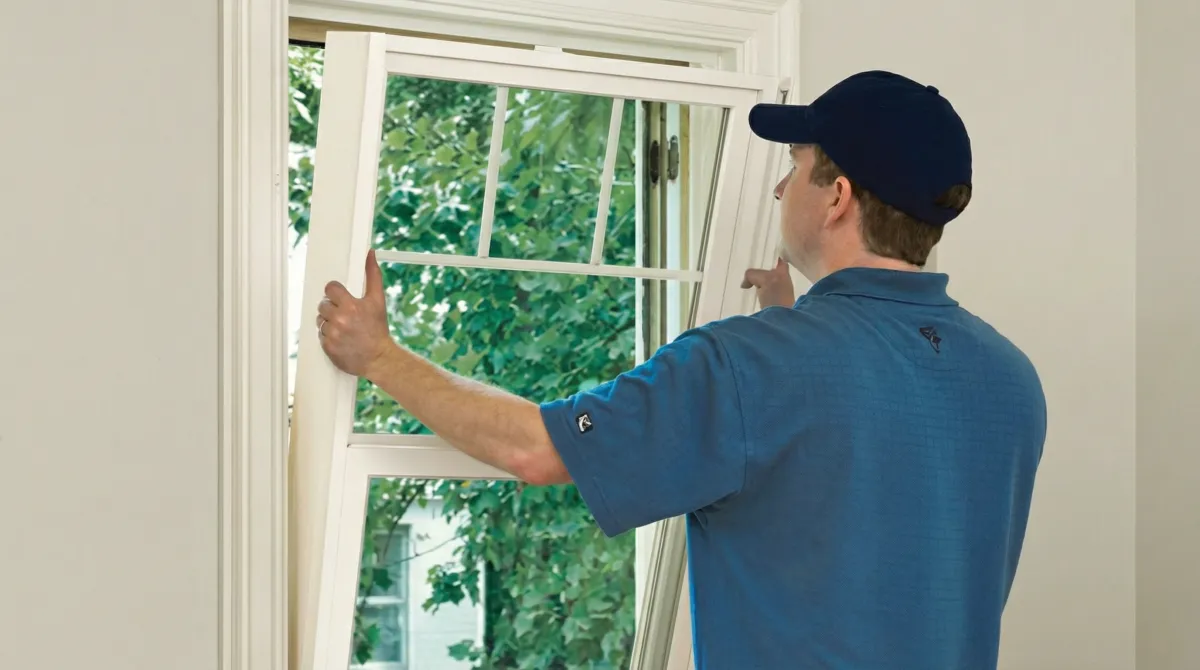 Professional contractors performing a residential window insulation and replacement service in Pueblo, CO